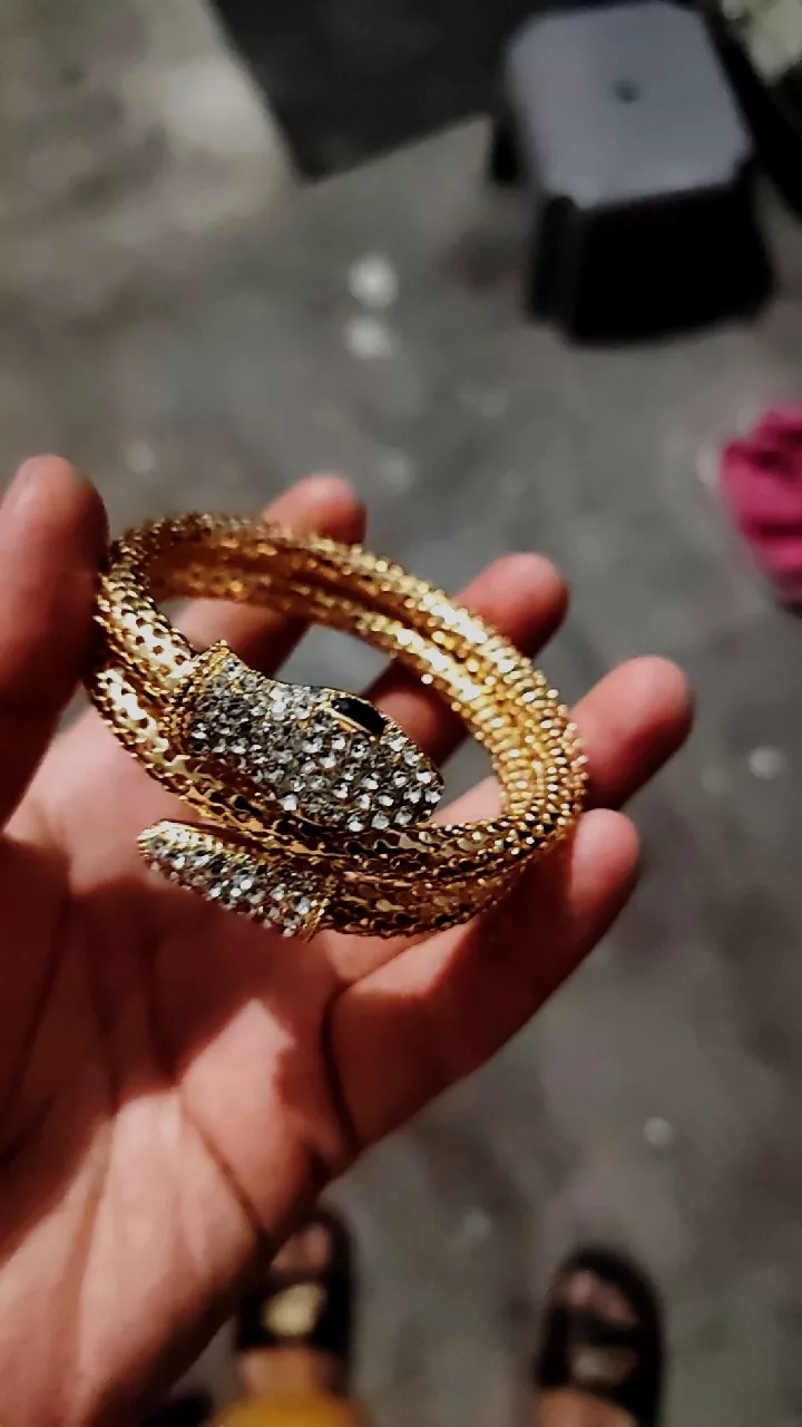 luxury gold snake wrap bracelet with rhinestone detailing luxury gold snake wrap bracelet with rhinestone detailing