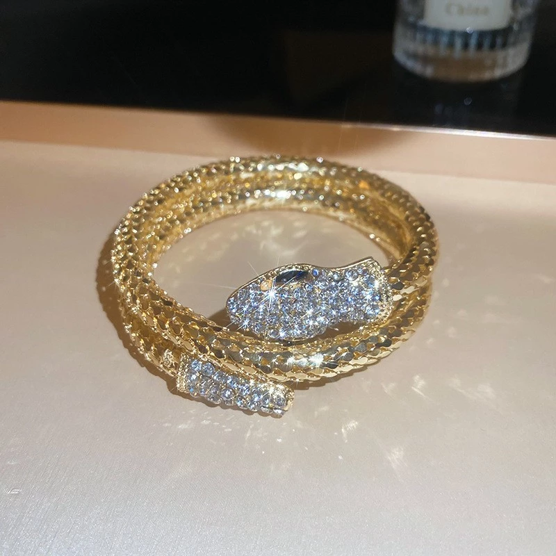 luxury gold snake wrap bracelet with rhinestone detailing luxury gold snake wrap bracelet with rhinestone detailing
