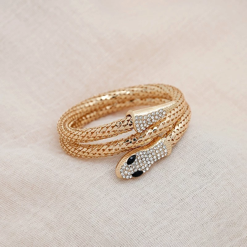 luxury gold snake wrap bracelet with rhinestone detailing luxury gold snake wrap bracelet with rhinestone detailing